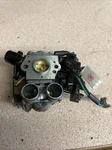 Husqvarna Chainsaw Oem 555 Autotune Carb. Assy. # 579194101 Used. Price: $100.00.