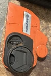 Husqvarna Clutch Cover 537341901 Chainsaw Orange Black Metal Plastic Used. Price: $35.00.